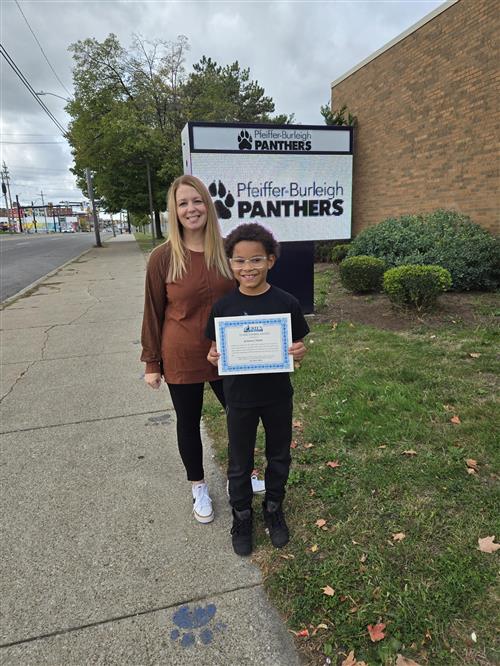 PB's October Stairclimber, Ja'Khari Childs, poses with his certificate.